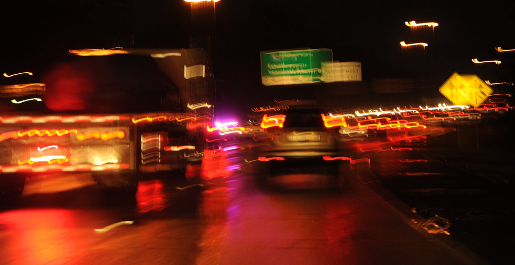 How Change Affects YOU, a blurry picture of cars at night on a highway, streaky brake lights