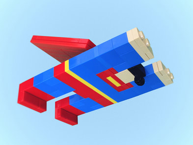 Image of Superman made of lego bricks, bright blue with red cape, white hands and red feet