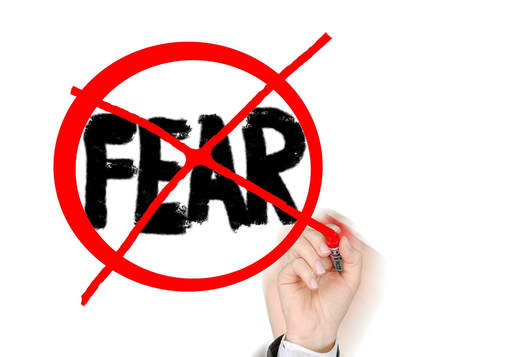 Image of the word fear in handwritten black print, with red circle around it and big red X across the image
